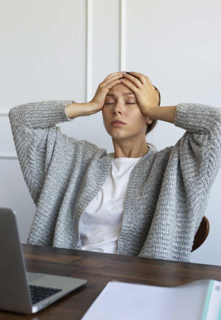 Woman at work distressing from IBS symptoms