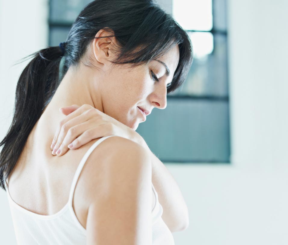Woman with nerve pain in shoulder